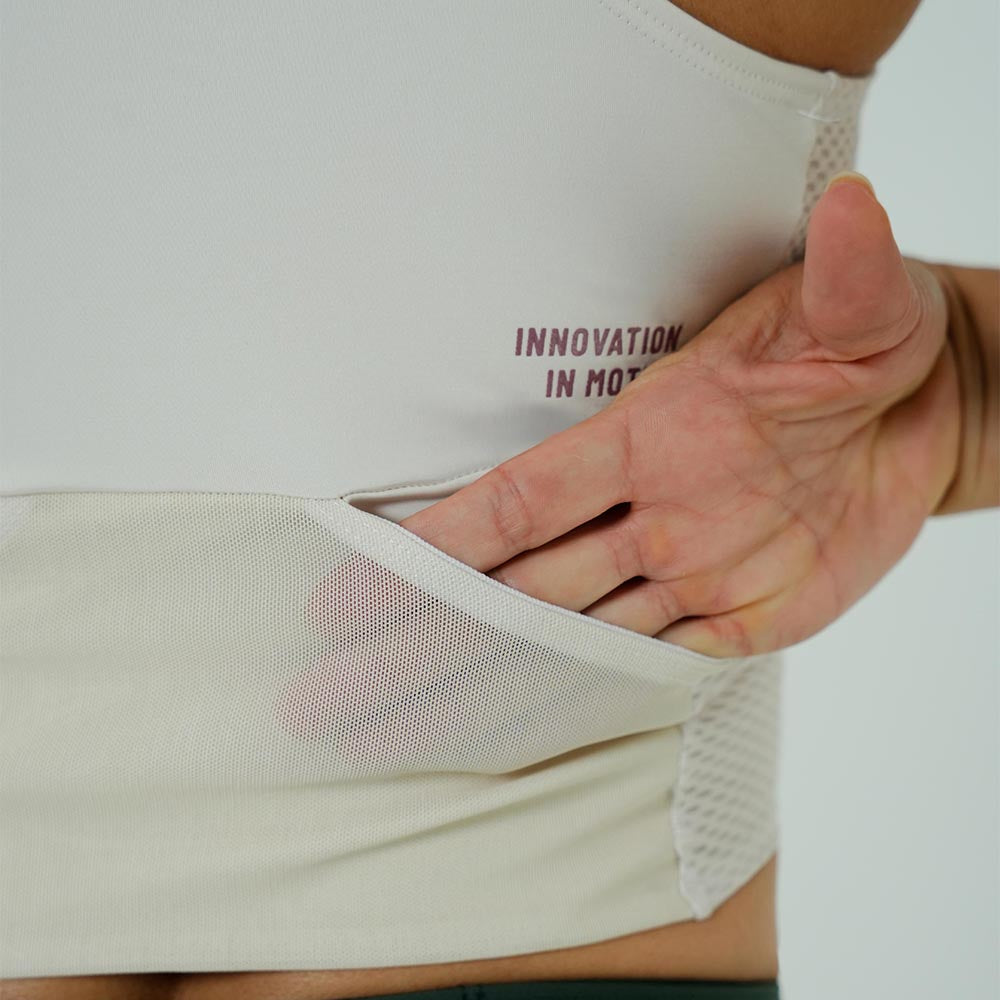 TOP RUNNING/PÁDEL POCKET IVORY PARA MUJER