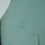 FALDA SHORT RUNNING/PÁDEL FLOW FIT GREEN PARA MUJER