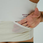 TOP RUNNING/PÁDEL POCKET IVORY PARA MUJER